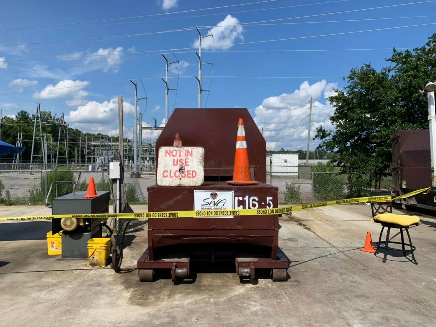 Woman charged after dog found in trash compactor